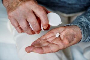 Elderly woman taking medicine